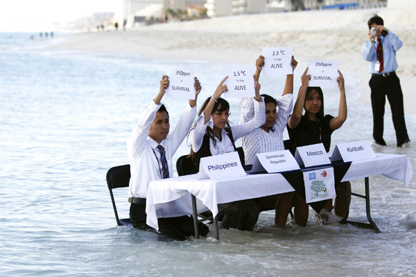 Environmental activists demonstrate in Cancun
