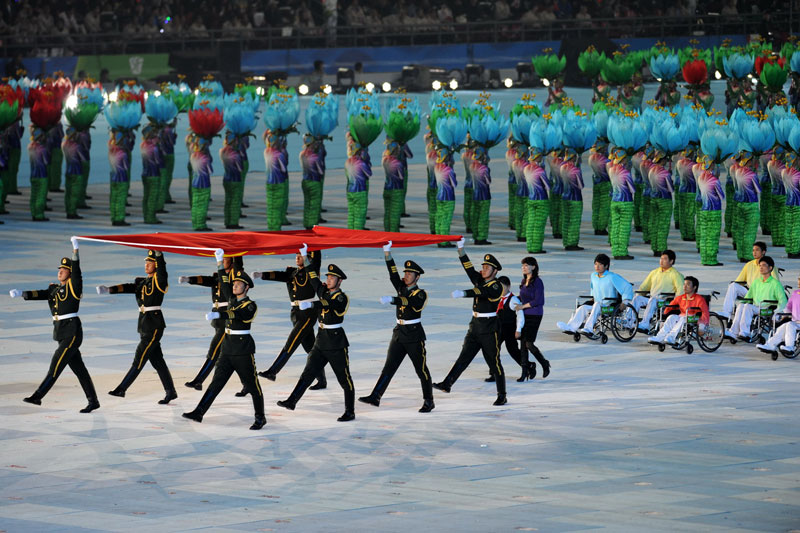 The opening ceremony of the 2010 Asian Para Games is held in Guangzhou, capital city of south China's Guangdong Province, on the evening of December 12. [Xinhua]