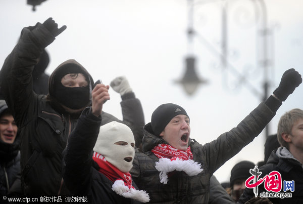 Protesters chant slogans as they gathered in central Moscow&apos;s Manege Square to remember a Spartak fan, Yegor Sviridov, who was killed a few days earlier in Moscow by several men from Russia&apos;s Caucasus region. [CFP]