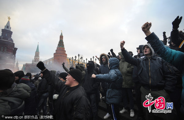 Protesters chant slogans as they gathered in central Moscow&apos;s Manege Square to remember a Spartak fan, Yegor Sviridov, who was killed a few days earlier in Moscow by several men from Russia&apos;s Caucasus region. [CFP]