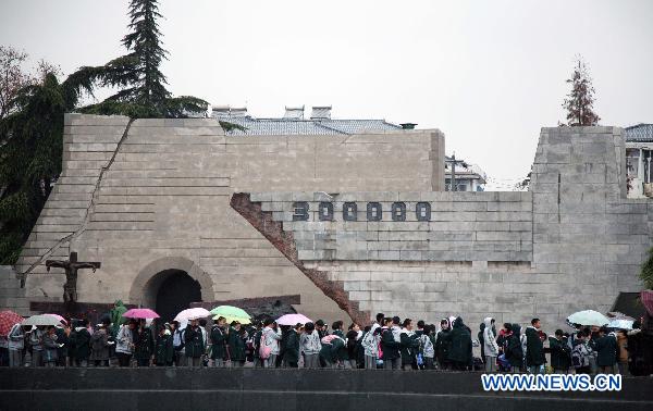 Visitors take a tour to the Memorial Hall of the Victims in the Nanjing Massacre in Nanjing, east China&apos;s Jiangsu Province, Dec. 12, 2010. A series of activities were held in Nanjing to mourn for more than 300,000 citizens of Nanjing massacred by Japanese invaders in 1937, marking the 73rd anniversary of the tragedy which falls on Dec. 13. [Xinhua]