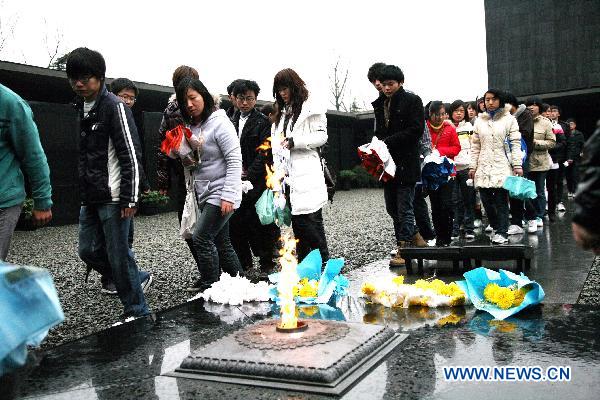 Visitors take a tour to the Memorial Hall of the Victims in the Nanjing Massacre in Nanjing, east China&apos;s Jiangsu Province, Dec. 12, 2010. A series of activities were held in Nanjing to mourn for more than 300,000 citizens of Nanjing massacred by Japanese invaders in 1937, marking the 73rd anniversary of the tragedy which falls on Dec. 13. [Xinhua]