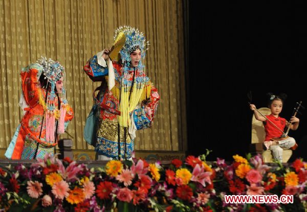 Fans of the Peking Opera perform in Beijing, capital of China, Dec. 11, 2010. Fans gathered together during a celebration in Beijing Saturday as Peking Opera was recognized as an intangible cultural heritage in November by the United Nations Educational, Scientific, and Cultural Organization (UNESCO). 