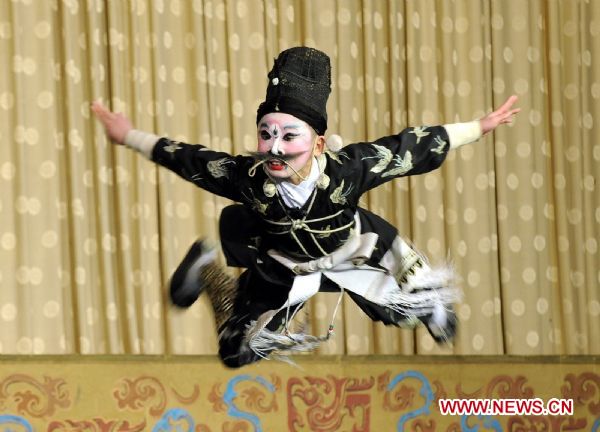 A fan of the Peking Opera performs in Beijing, capital of China, Dec. 11, 2010. Fans gathered together during a celebration in Beijing Saturday as Peking Opera was recognized as an intangible cultural heritage in November by the United Nations Educational, Scientific, and Cultural Organization (UNESCO). 