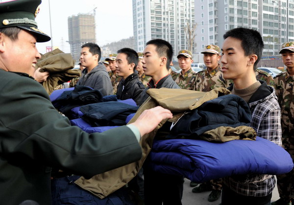 The quadruplets receive their supplies after being recruited in Jinan, East China's Shandong province, Dec 12, 2010. [Photo/Xinhua] 