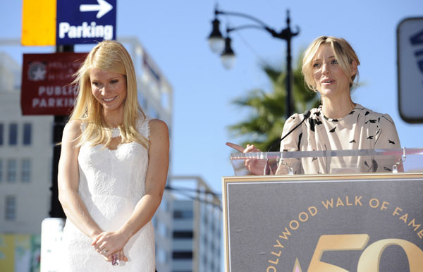 Gwyneth Paltrow (L) listens to comments from director Shana Feste (R) at a ceremony where the actress received a star on the Hollywood Walk of Fame in Los Angeles December 13, 2010.