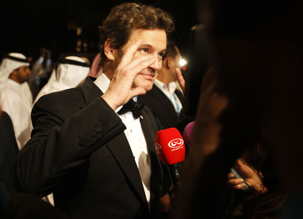 British actor Colin Firth speaks to the media during his arrival at the red carpet for the opening ceremony of the 7th edition of the Dubai International Film Festival December 12, 2010.