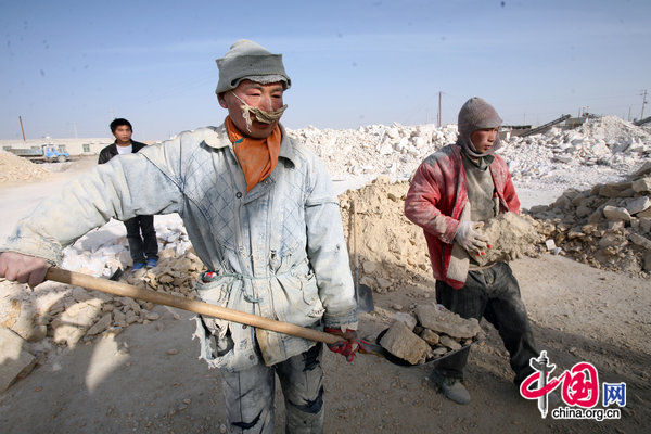 Reportedly enslaved Chinese mentally disabled people work at the Jiaersi Green Construction Material Chemical Factory in Toksun county, Northwest China&apos;s Xinjiang Uygur autonomous region. [CFP] 