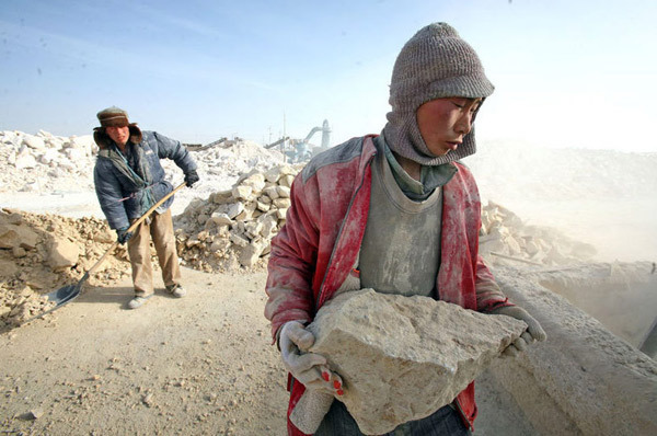 Reportedly enslaved Chinese mentally disabled people work at the Jiaersi Green Construction Material Chemical Factory in Toksun county, Northwest China&apos;s Xinjiang Uygur autonomous region. [Xinjiang Metropolis News] 