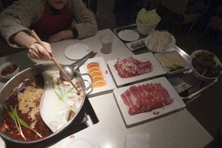 A typical hotpot is served at a restaurant in Shanghai. 