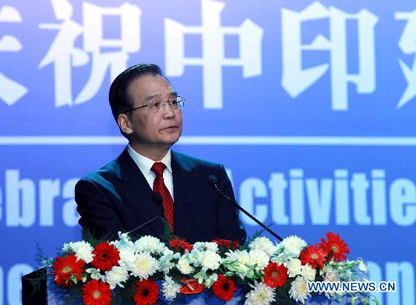 Chinese Premier Wen Jiabao addresses the celebration activities of the 60th anniversary of the Establishment of Diplomatic Relations between China and India, in New Delhi, India, Dec. 16, 2010. [Liu Weibing/Xinhua]