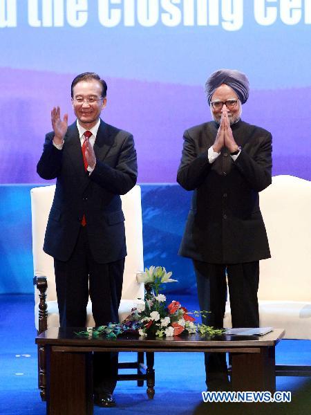 Chinese Premier Wen Jiabao (L) and Indian Prime Minister Manmohan Singh attend the celebration activities of the 60th anniversary of the Establishment of Diplomatic Relations between China and India, in New Delhi, India, Dec. 16, 2010. [Liu Weibing/Xinhua]