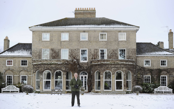 WikiLeaks founder Julian Assange poses for photographers outside Ellingham Hall, the home of his friend, journalist Vaughan Smith, in Norfolk, England December 17, 2010. [Xinhua]