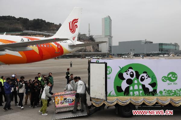 Two giant pandas named Kai Kai and Xin Xin -- after 'kaixin,' the Chinese word for 'happy' -- arrived in Macao Saturday to help the Macao Special Administrative Region (SAR) celebrate its 10th anniversary.