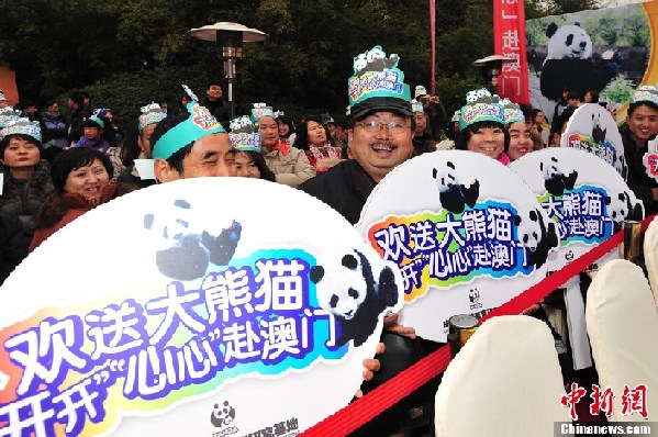 Two giant pandas named Kai Kai and Xin Xin -- after 'kaixin,' the Chinese word for 'happy' -- arrived in Macao Saturday to help the Macao Special Administrative Region (SAR) celebrate its 10th anniversary.