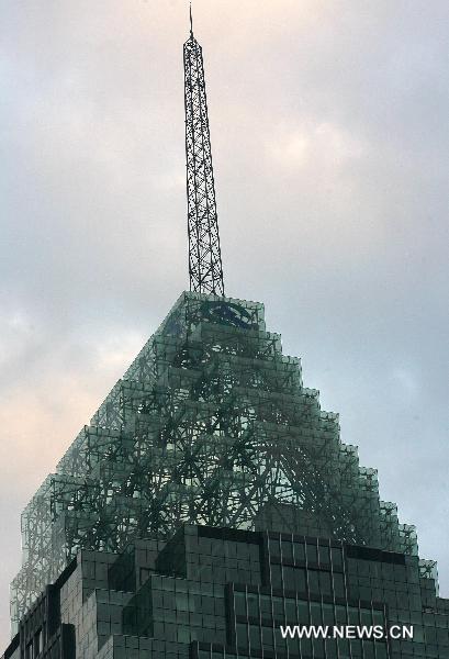 Photo taken on Dec. 18, 2010 shows a 68-storey building of China Minsheng Bank in Wuhan, capital of central China&apos;s Hubei Province. The 325-meter skyscraper, the tallest building in Wuhan, was put into use Saturday. [Xinhua]