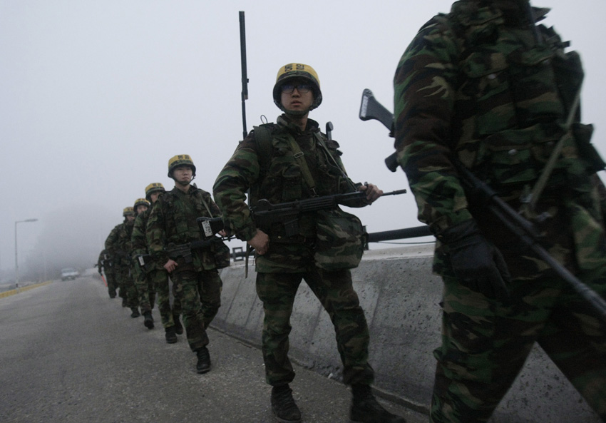 South Korean marines patrol on Yeonpyeong Island December 20, 2010. South Korea will conduct a live-fire drill Monday from a western border island shelled last month by the Democratic People&apos;s Republic of Korea (DPRK), the Joint Chiefs of Staff (JCS) in Seoul said. [Xinhua]