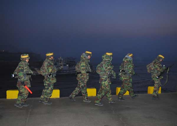 South Korean marines patrol on Yeonpyeong Island December 19, 2010. South Korean military to carry out live-fire military drills in the sea near Yeontyeong Island on Monday, a Defense Ministry spokesman told Xinhua. [Xinhua]