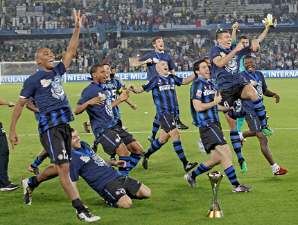 Inter Milan players celebrate with the Club World Cup trophy after beating African side TP Mazembe 3-0 in the final in Abu Dhabi, UAE, on Saturday.