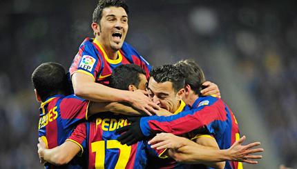 Barcelona players celebrate after scoring against Espanyol during their Spanish La Liga match on Saturday. Barcelona trounced the home side 5-1.