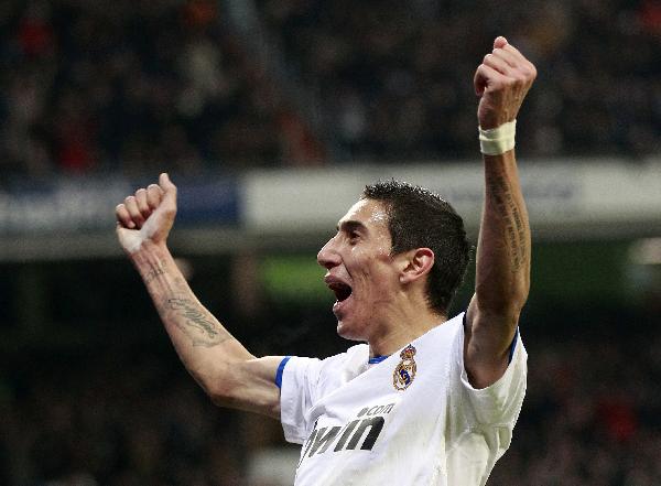 Real Madrid's Angel Di Maria celebrates his goal against Sevilla during their Spanish first division soccer match at Santiago Bernabeu stadium in Madrid December 19, 2010. (Xinhua/Reuters Photo)