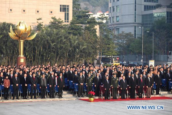 China&apos;s mainland and Macao officials, as well as invited guests, attend the flag-raising ceremony marking the 11th anniversary of Macao&apos;s handover at the Golden Lotus Square in Macao Special Administrative Region, south China, Dec. 20, 2010. [Xinhua]