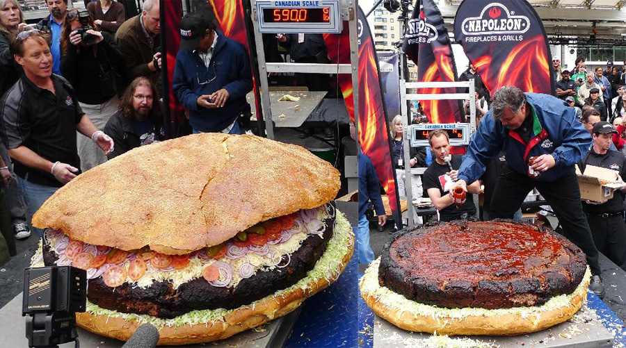 People weigh a giant hamburger in Toronto, May 7, 2010. Barbecue chef Ted Reader and his assistants made a hamburger with a weight of 590 pounds (267.6 kilograms). The hamburger is waiting to be affirmed as a new Guinness World Record for world&apos;s heaviest hamburger. [Xinhua]