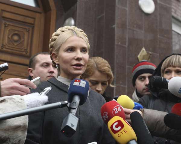 Ukrainian former Prime Minister Yulia Tymoshenko talks to the media as she arrives at the state prosecutor's office in Kiev December 15, 2010. Charges were filed against former Tymoshenko on Monday over alleged misuse of state funds during her tenure from 2007 to 2010, Tymoshenko's spokeswoman said in a statement. [Xinhua]