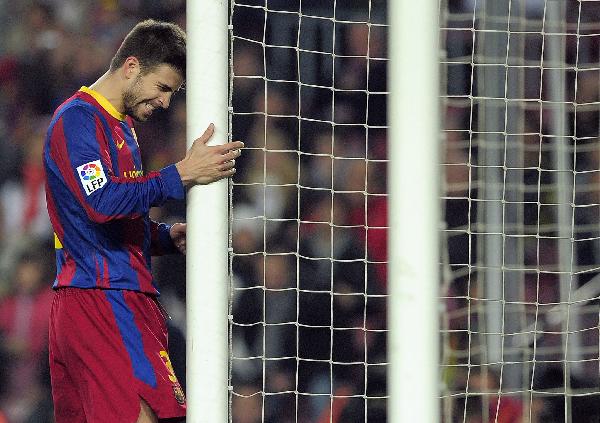 Barcelona's Gerard Pique reacts during their Spanish King's Cup soccer match against Athletic Bilbao at Camp Nou stadium in Barcelona December 21, 2010. Barca ties with Athletic Bilbao 0-0. (Xinhua/AFP Photo)