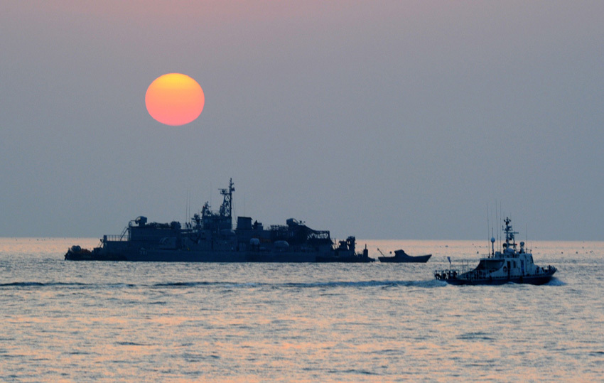 A South Korean navy vessel sails off Yeonpyeong island near the disputed waters of the Yellow Sea on December 22, 2010.