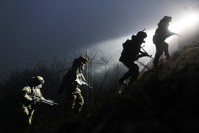 In this Tuesday, Dec. 21, 2010 image, South Korean Army soldiers patrol near the seaside in Dangjin, south of Seoul, South Korea.