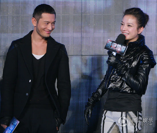 Zhao Wei (right) and Huang Xiaoming promote the new film 'Underground Resistance' ('Shi Kong Di Dao') in Tianjin on Tuesday, December 21, 2010.