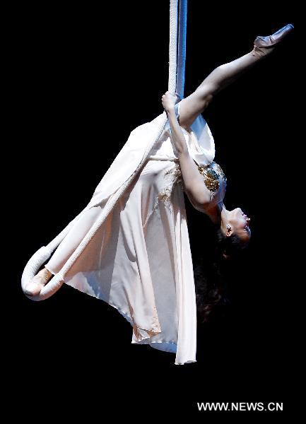 Ballet artist Qiu Siting performs on stage 'Chopin on Point', a symphony ballet to commemorate the 200th anniversary of birthday of Polish composer and pianist Fryderyk Chopin, in Beijing, capital of China, Dec. 22, 2010.