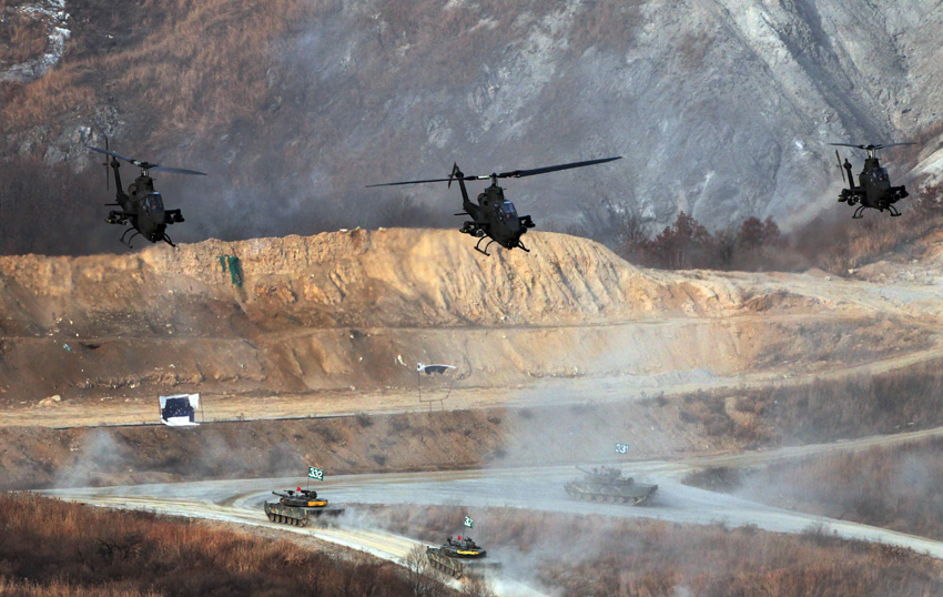 Helicopters and tanks are seen during a military drill in Pocheon, South Korea, on Dec. 23, 2010. [Xinhua] 