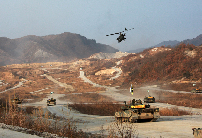 A helicopter and tanks are seen during a military drill in Pocheon, South Korea, on Dec. 23, 2010. [Xinhua]