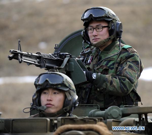 South Korean soldiers take part in a military drill in Pocheon, South Korea, on Dec. 23, 2010. [Pool/Xinhua]