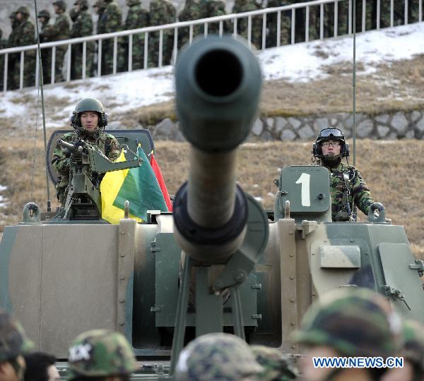 South Korean soldiers take part in a military drill in Pocheon, South Korea, on Dec. 23, 2010. [Pool/Xinhua]