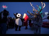 Santa Claus and ICIUM mascot Ming Ming Panda celebrate the opening of the ice sculpture park ICIUM, Wonderworld of Ice, which opened in Levi, one of Finland's largest ski resorts, on December 18, 2010. [Photo by Radio 86]
