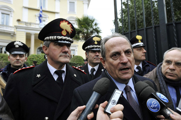 Greek ambassador to Italy Michael E. Cambanis talks to reporters outside the Greek embassy in Rome December 27, 2010. [China Daily/Agencies] 