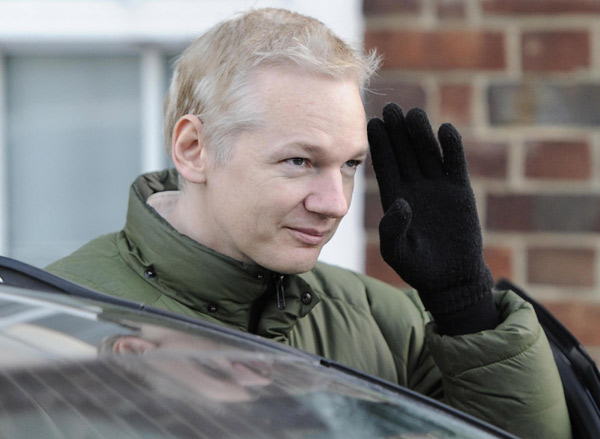 WikiLeaks founder Julian Assange gestures as he leaves Beccles Police station in Suffolk, England in this Dec 17, 2010 file photo. Assange said he's being forced into penning an autobiography to keep his organization from going under. [Agencies]