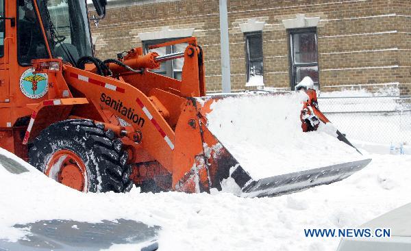 A man plows snow after a blizzard in the New York City borough of Queens on Dec. 27, 2010. 