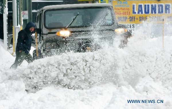 A man plows snow after a blizzard in the New York City borough of Queens on Dec. 27, 2010. 