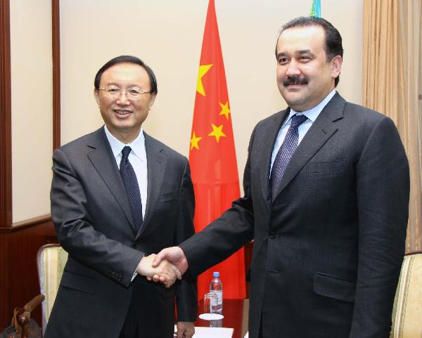 Kazakh Prime Minister Karim Masimov (R) shakes hands with visiting Chinese Foreign Minister Yang Jiechi during their meeting in Astana, capital of Kazakhstan, Dec. 28, 2010.[Zhao Yu/Xinhua]