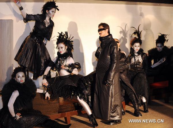 Models present designed costumes for an avant-garde musical 'The Lady of the Camellias' in Taipei, southeast China's Taiwan, Dec. 28, 2010. An innovated musical adapted from the classic novel 'The Lady of the Camellias' will be staged in Taipei in 2011 February.