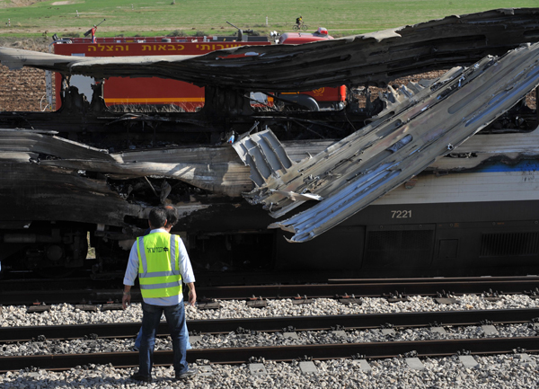 The photo taken on Dec.28, 2010 shows a burnt passenger train near Shefayim, Israel. A fire broke out on a train near the central Israeli town of Shfayim on Tuesday morning, injuring dozens of passengers, local media reported. 