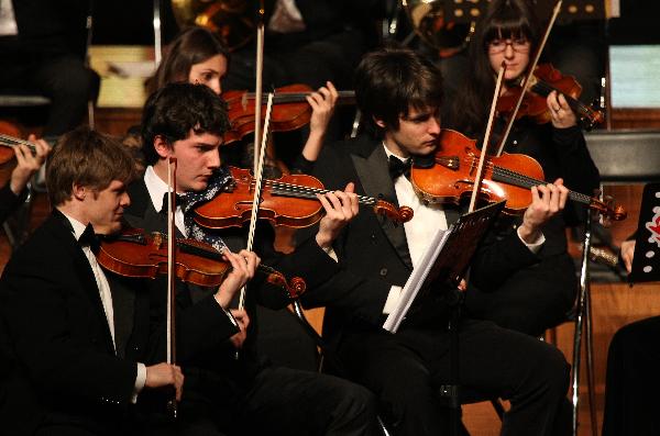 Musicians perform during a symphony concert in Nantong, east China's Jiangsu Province, Dec. 28, 2010. A total of 70 musicians from Vienna Classical Symphony Orchestra of Austria presented a symphony concert on Tuesday. [Xinhua photo]