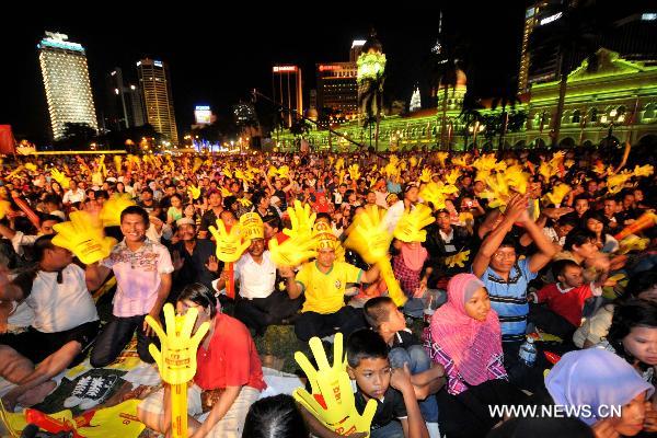 People attend the New Year celebrations in Kuala Lumpur, Malaysia, on Dec. 31, 2010.