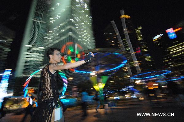 A street performer dances during the countdown to celebrate the New Year at the Marina Bay area in Singapore, Dec. 31, 2010. 