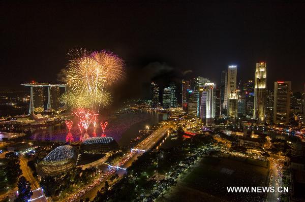 Fireworks explode over the Marina Bay area to celebrate the New Year in Singapore, Jan. 1, 2011. 