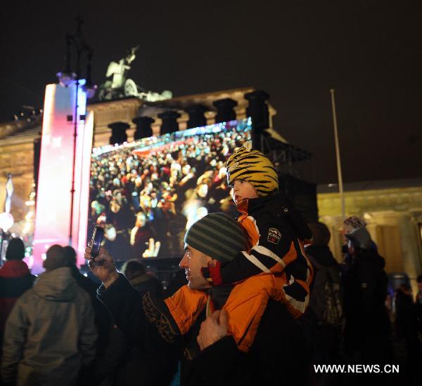 People celebrate the New Year near the Brandenburg Gate in Berlin, Germany, Dec. 31, 2010. 